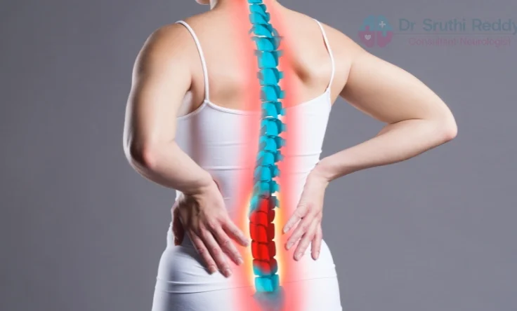Doctor examining a patient with back pain and sciatica symptoms.