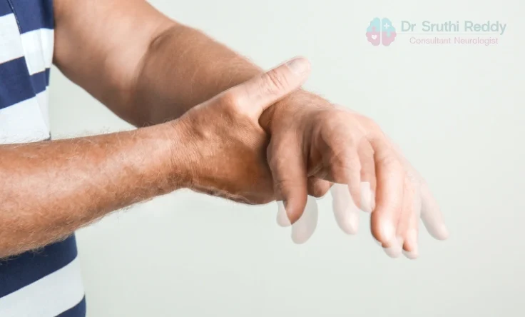 Doctor supporting an elderly patient with Parkinson’s disease during consultation.