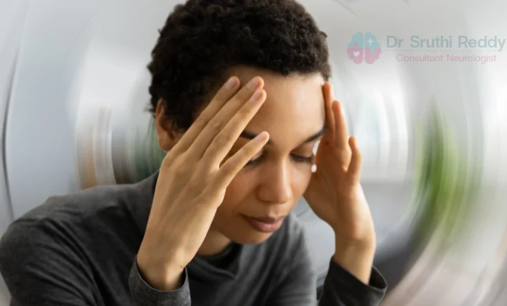 Doctor assessing a patient’s balance to diagnose vertigo.